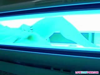 Sexy girl caught masturbating in the solarium