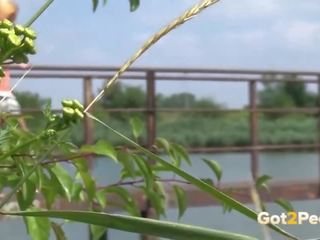 Pretty Blonde Babe Pisses Off Bridge Into River