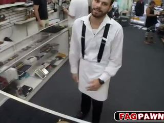 Dude blows a cock behind counter in a shop